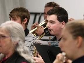 Members of the Laurentian Concert Band rehearse for a holiday concert inn this file photo. Laurentian is cutting its music program. John Lappa/Sudbury Star/Postmedia Network