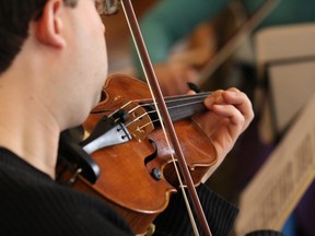 In this file photo, Christian Robinson, of the Sudbury Symphony String Quartet, performs at the main branch of the Greater Sudbury Public Library. As part of a fundraising effort, the Sudbury Symphony String Quartet plans to perform Andrzej Zubek's Zubi-Rag later this year. JOHN LAPPA/THE SUDBURY STAR