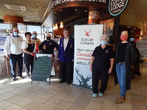 Members of the Sarnia Elks Lodge stand with Bridge Coffee Shop manager Susan Hall (second from left) and Bluewater Bridge Duty Free Shop's Tania Lee Hartmann (far right) to celebrate Truck Driver Appreciation Day on March 30. Truck drivers crossing the border received free large coffees throughout the day. Carl Hnatyshyn/Sarnia This Week