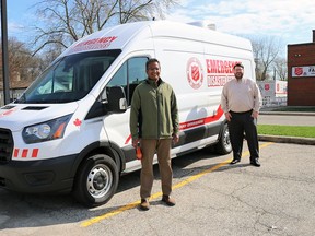 Deve Persad, Sarnia Evangelical Missionary Church's lead pastor, left, and Lt. Brad Webster, Sarnia Salvation Army corps officer and pastor, stand beside the Salvation Army's recently-acquired emergency disaster services vehicle. The vehicle will be on display during the Sarnia EMC's drive-thru food drive for the Salvation Army April 24. (Carl Hnatyshyn/Sarnia This Week)