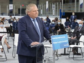 Ontario Premier Doug Ford listens to a question during the daily briefing at a mass vaccination centre in Toronto on Tuesday, March 30, 2021. On Thursday, Ford announced a four-week Ontario-wide "shutdown" that would begin Saturday, in response to an "alarming" surge in COVID-19 infections.


THE CANADIAN PRESS/Frank Gunn