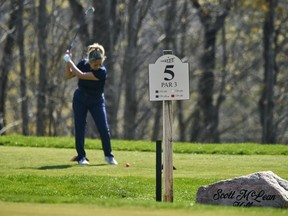A golfer prepares to swing at The Bridges Golf Course in Tillsonburg on Saturday. The course opened in contravention of the province's COVID-19 stay-at-home order. Geoff Robins/CANADIAN PRESS ORG XMIT: POS2104241915468001