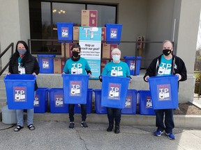 Emmi Lunel, left, Angela Johnston, co-chair TP North Bay eighth annual campaign, campaign chairwoman Ellen Faulkner and Michael Phillips pose outside the Davedi Club. The Davedi Club is one of the drop-off locations for the annual toilet paper campaign.