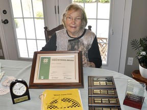 Caroline Vivian, of Mitchell, holds her 40-year certificate with 4-H Ontario she was presented last month. She also has displayed other 4-H memorabilia over the last four decades, including their first club "Which Came First - The Chicken Or The Egg?" ANDY BADER/MITCHELL ADVOCATE