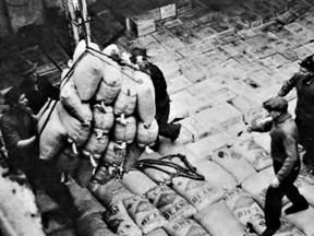 Loading bags of beans into the hold of the Superior at the Wallaceburg Government Dock, 1938. The Superior was a frequent visitor to Wallaceburg's Government Dock. Like the Magog, the Superior was a package freighter and, at 262 feet long and 39 feet wide, was very similar in size to the Magog. This photo gives some idea of what it would have looked like when pallet-loads of glassware, and other cargoes, were slung into the hold of the Magog. Photo from the March-April 1991 edition of Telescope.