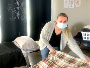 Ricki Michiels, Mental Health Transition worker at Walpole Island First Nation Warming Shelter, prepares some beds at the shelter. The United Way of Sarnia-Lambton has committed $30,000 over the next 12 months to assist in the renovations allowing the shelter to safely help homeless women, and to allow for proper safety and other health requirements at the shelter. United Way photo