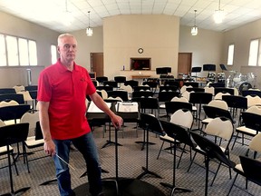 In this file photograph from 2019, Dave Babbitt stands in front of the Wallaceburg Community Concert Band's music stands set up at the Community Baptist Fellowship Church in Wallaceburg. File photo/Courier Press