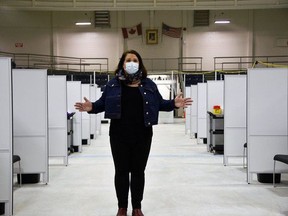 Jaime Fletcher, manager of the Southwestern Public Health COVID-19 vaccination task force, stands in front of the 36 vaccination stations on the arena surface at the St. Thomas-Elgin Memorial Arena. Dr. Joyce Lock, the region's top doctor, said the Pfizer vaccine is effective against the variants of the COVID-19 virus behind at least 18 of the area's 72 ongoing cases. (Kathleen Saylors/Postmedia Network)