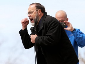 Pastor Henry Hildebrandt of Aylmer's Church of God was among the speakers at an anti-lockdown rally held Monday at Chatham's Tecumseh Park. Mark Malone/Postmedia Network