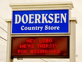 Businesses in Port Dover, Delhi and Port Rowan have joined the #SignWars marketing phenomenon that is sweeping North America. Above was the message flashing to motorists passing by Doerksen Country Market on Bay Street in Port Rowan Monday. – Monte Sonnenberg