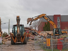 Demolition crews tear down the former Sands motel, Wednesday. Michael Lee/The Nugget