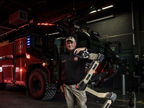 Pictured beside a bomb-disposal robot and in front of an aircraft-crash rescue truck at Toronto Pearson Fire and Emergency Services, David Clarke has been hired as Perth County's new emergency management coordinator. Submitted image