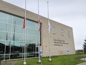 Flags outside Quinte West city hall fly at half-staff Friday. They were lowered after the traffic death Thursday of Christopher Bishop, 14, of Quinte West.