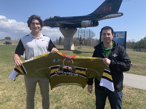 Jake Fullerton, left, and his father Todd Fullerton in front of the CF-101 Voodoos Jet at CFB North Bay. Powassan Voodoos Photo