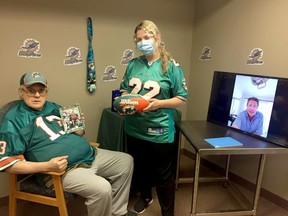 Pictured are Wes Maher and Jessica Yates with Dan Marino’s video on the screen. Handout