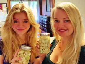 Mother Lise Morton, right, and daughter Lily Demaiter, of Courtland, are surprised and delighted that a short video they posted to TikTok on the basics of making pickled garlic has gone viral. – Contributed photo