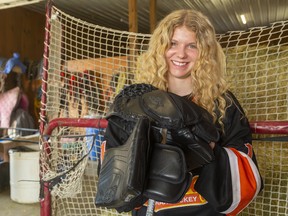 Taya Currie, a goaltender with the AAA U16 Elgin-Middlesex Chiefs, has a chance next month to become the first female player chosen in an Ontario Hockey League draft. She was photographed in her family's barn in Parkhill on May 2. Mike Hensen/Postmedia Network