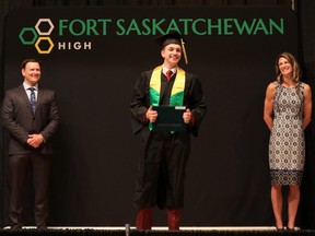 A 2020 Fort High graduate poses with staff during a COVID-friendly graduation ceremony last year. EIPS schools are currently planning their COVID-friendly celebrations for 2021 graduates. Photo Supplied.