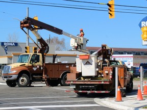Crews work on the signals at the Main Street-Memorial Drive-Murray Street intersection, Friday.
PJ Wilson/The Nugget