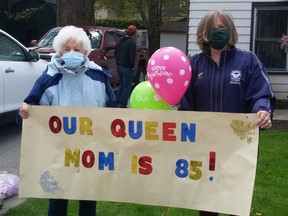 Shirley Hodge cried tears of joy when she realized that the convoy of vehicles – some festooned with balloons, streamers and hand-made signs – that rolled slowly past her Port Elgin home May 8 were wishing her Happy Birthday. Daughter Barb Deboer organized the COVID-style 85th birthday celebration with socially distanced family and friends. [Frances Learment photo]
