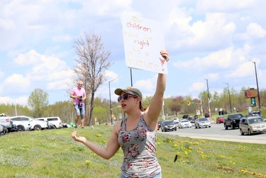 Protesters opposed to COVID-19 restrictions participated in an anti-lockdown rally in the parking lot across from Bell Park in Sudbury, Ontario on Saturday, May 15, 2021. Greater Sudbury Police officers were also present at the event. Ben Leeson/The Sudbury Star/Postmedia Network
