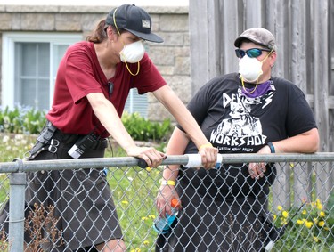 Location production assistant Greg Johnson and location manager Melissa Villeneuve on the set of A Christmas Letter in Sault Ste. Marie, Ont., on Thursday, May 20, 2021. (BRIAN KELLY/THE SAULT STAR/POSTMEDIA NETWORK)