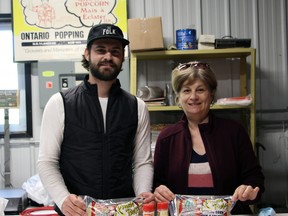 Tanner Townsend and his mother Livia Townsend show some of the products produced at their Ontario Popping Corn facility near Walsingham. ALEX HUNT