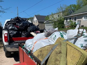More than 15 members of the city's homeless community pitched in Monday to clean up two areas in the core of the city. They gathered enough garbage to fill the back of a pickup and trailer, and there still wasn't enough room. The clean-up was organized by Hope's Kitchen.