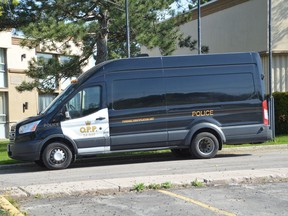 An OPP forensic identification unit van is seen off 6th Street East in Owen Sound on May 18.