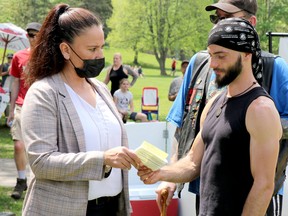 Frasier Keany is ticketed by Sault Ste. Marie Police Service for organizing an anti-lockdown protest at Bellevue Park in Sault Ste. Marie, Ont., on Saturday, May 23, 2021. (BRIAN KELLY/THE SAULT STAR/POSTMEDIA NETWORK)