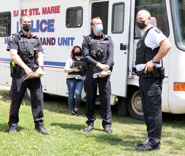Sault Ste. Marie Police Service officers monitor an anti-lockdown protest at Bellevue Park in Sault Ste. Marie, Ont., on Saturday, May 23, 2021. (BRIAN KELLY/THE SAULT STAR/POSTMEDIA NETWORK)