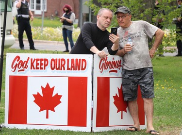 Anti-lockdown protest at Bellevue Park in Sault Ste. Marie, Ont., on Saturday, May 23, 2021. Sault Ste. Marie Police Service monitors in the background. (BRIAN KELLY/THE SAULT STAR/POSTMEDIA NETWORK)