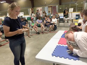 Judge Molly Sayers smiles during the rabbit show at the Dresden Exhibition in this file photograph from 2019. File photo/Courier Press