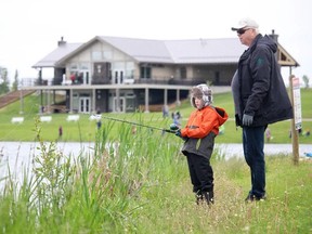 Local residents are being encouraged to be mindful of water safety this summer. A local family is pictured fishing at the West River's Edge in Fort Saskatchewan in 2018. Photo by the Record / file.