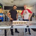 Jazz Virdi of Kurry LOTW, left with Carl Hensrud of the Hungry Pug Cafe with the meal they prepared for staff at the Lake of the Woods District Hospital.