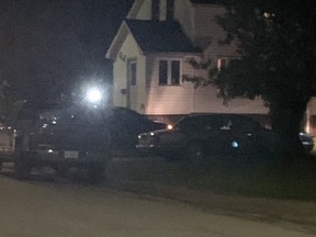 North Bay Police Emergency Response Team surrounds a house on King Street West Tuesday night. Few details were available.