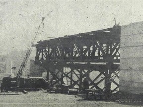 A photo of the laying of the steel for the main span of the interprovincial bridge linking Cotnam's Island to Morrison's Island.