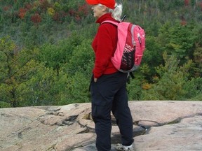 Avid outdoor enthusiast Shirley Mills admires the landscape on a hike
in 2011. Provided