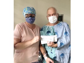 Pembroke Regional Hospital Surgical program Registered Nurse Moira Ryan (left) presents Rick Power with his winnings from the Week 14 draw of the PRHF Catch the Ace draw. He won $3,056.