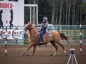 A rider weaves her horse through the poles competition during the Alberta Junior/Senior High School Rodeo held at the Westward Rodeo Grounds outside of Whitecourt last September. A central Alberta high school rodeo went forward Saturday after Alberta Health granted organizers an exemption from ongoing public health restrictions.