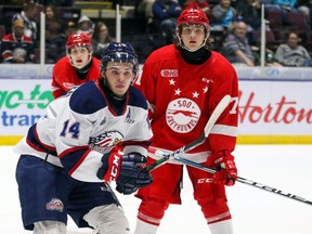 Photo courtesy Eric Young
Greyhounds centre Tanner Dickinson (right) and Saginaw's D.J. Busdeker keep an eye on the action during a 2019 OHL clash at Dow Event Center in Saginaw