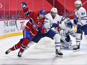 Artturi Lehkonen (62) of the Montreal Canadiens and TJ Brodie (78) of the Toronto Maple Leafs race for the puck during the second period at the Bell Centre on April 28, 2021, in Montreal, Que. (Photo by Minas Panagiotakis/Getty Images)