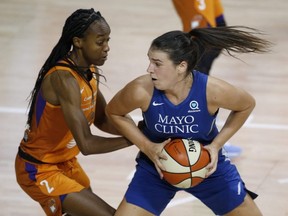 Bridget Carleton, right, of the Minnesota Lynx is guarded by Phoenix Mercury’s Shatori Walker-Kimbrough during the first half of a WNBA game at the FELD Entertainment complex in Palmetto, Fla., on Sept. 17, 2020. (Reinhold Matay-USA Today Sports)