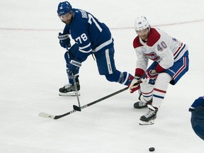 Toronto Maple Leafs' T.J. Brodie (78) battles for the puck against Montreal Canadiens' Joel Armia (40) during the second period in Game 2 of their first-round series in the 2021 Stanley Cup playoffs at Scotiabank Arena in Toronto on Saturday, May 22, 2021. (Nick Turchiaro-USA TODAY Sports)