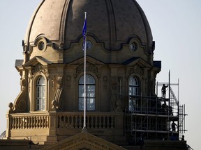 Workers continue restoration of the Alberta Legislature building dome in Edmonton on Thursday April 15, 2021. The legislature will stay closed until after the May long weekend, citing concerns around the COVID-19 pandemic, according to a letter from the legislature's Speaker.