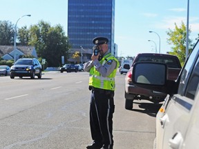 A Grande Prairie Enforcement Services Peace Officer checks speeders outside Hillcrest Christian School in this file photo. At the end of 2020 the traditional ticket will be gone, replaced by the province's Administrative Penalty Information System, currently still under development.