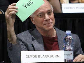 Council candidate Clyde Blackburn holds up a 'yes' card to a question during a City of Grande Prairie municipal election candidates forum on Tuesday October 3, 2017 at Revolution Place. Blackburn, 67, passed away Sunday night.