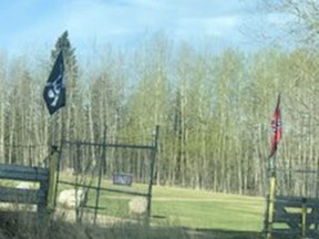 The Brazeau County property where a Hitler Youth flag was reported May 11. As of 8:30 a.m. on May 13, the Nazi banner had been removed and replaced with a pirate flag. A Confederate flag remained on the adjacent pole.