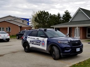 Two marked police vehicles remained at the scene of a police incident at the Bayfield Landing housing complex earlier Sunday, May 2, 2021 in Owen Sound, Ont. (Scott Dunn/The Sun Times/Postmedia Network)