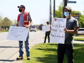 Reliance Home Comfort employees walk the picket line in Chatham, Ont., on Friday, May 14, 2021, after being locked out. (Mark Malone/Chatham Daily News)